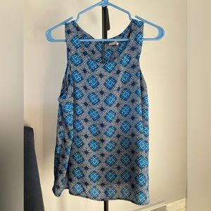 Blue work sleeveless blouse with fun geometric pattern